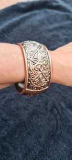 Te koop nieuwe bronskleurige metalen armband, breedte is 3cm, Ophalen of Verzenden, Zo goed als nieuw, Bruin, Overige materialen