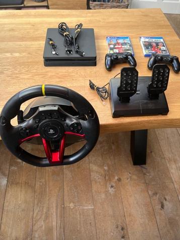 Ps4 slim black 500gb + steering wheel beschikbaar voor biedingen