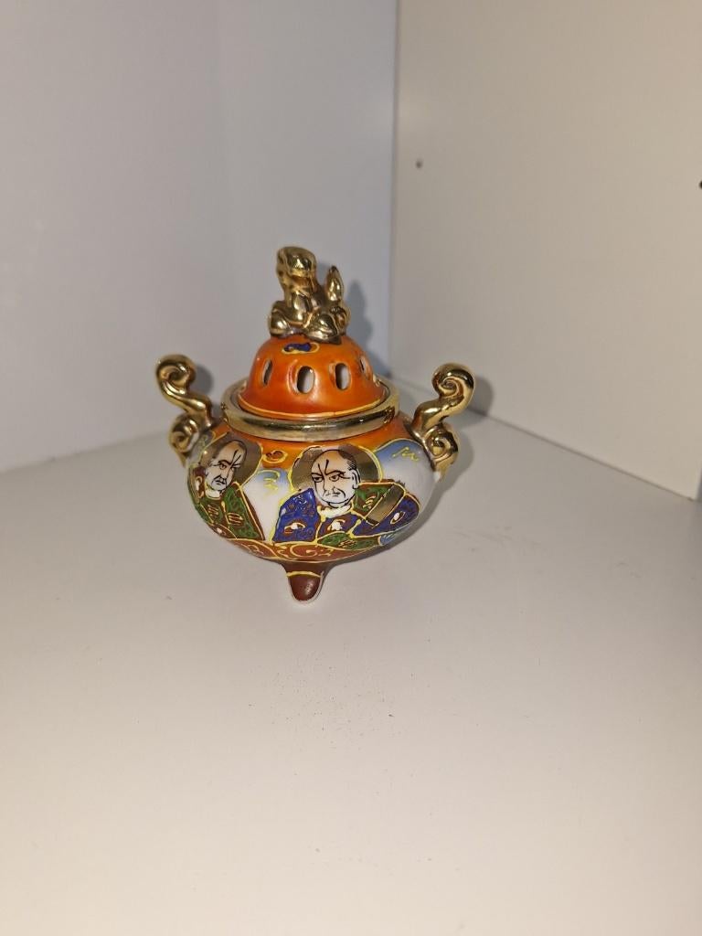 Satsuma Wierook Potje, Ophalen