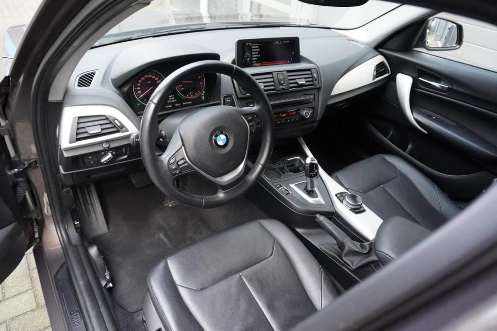 BMW 1-serie 116i High Executive, Gebruikt, 4 cilinders, Bruin, Navigatiesysteem