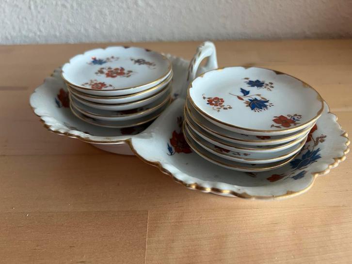 Een lief petitfour setje met 10 schoteltjes van Jungerhans., Antiek en Kunst, Antiek | Servies compleet, Ophalen of Verzenden