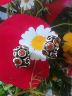Pandora rozenpad met prachtige, zonnige, oranje zirkonia's, Pandora, Ophalen of Verzenden, Zo goed als nieuw, 2 of 3 bedels