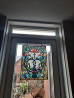 Glas in lood raam met scheurtje, Ophalen