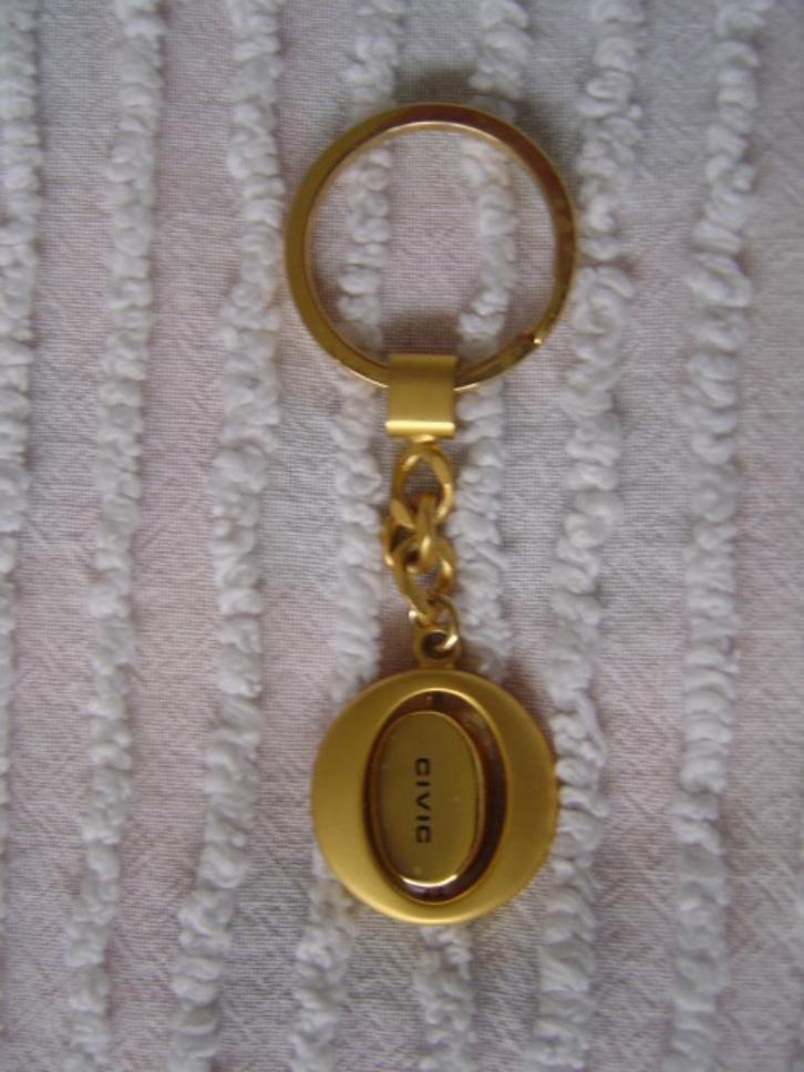 Mooie goudkleurige metalen sleutelhanger uit India, Verzamelen, Sleutelhangers, Zo goed als nieuw, Merk, Ophalen of Verzenden