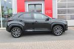 Toyota Yaris Cross 1.5 Hybrid Dynamic Plus (bj 2024), Stof, Gebruikt, Adaptive Cruise Control, Met garantie (alle)