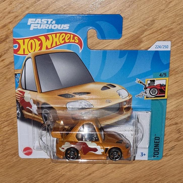 600 - Hotwheels Tooned Toyota Supra in verpakking., Hobby en Vrije tijd, Modelauto's | Overige schalen, Nieuw, Auto, Ophalen of Verzenden