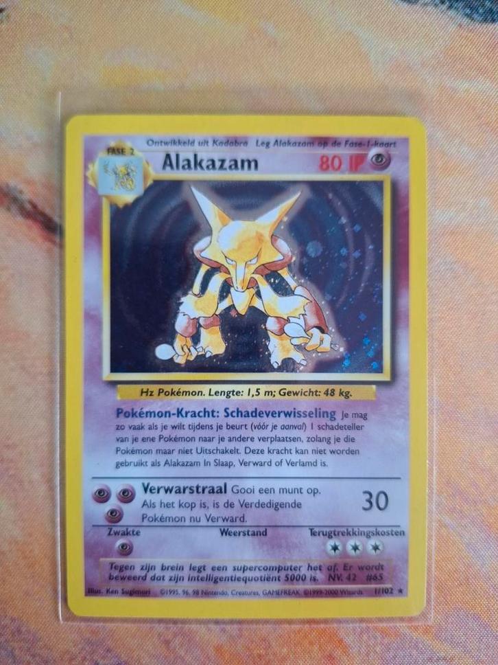 Alakazam Base Set 1/102 NL, Hobby en Vrije tijd, Verzamelkaartspellen | Pokémon, Zo goed als nieuw, Meerdere kaarten, Foil, Verzenden