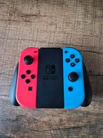 Nintendo Switch Joy Cons + Houder, Spelcomputers en Games, Spelcomputers | Nintendo Switch, Ophalen of Verzenden, Zo goed als nieuw