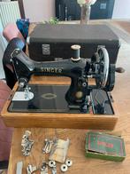Antieke singer hand naaimachine, Ophalen