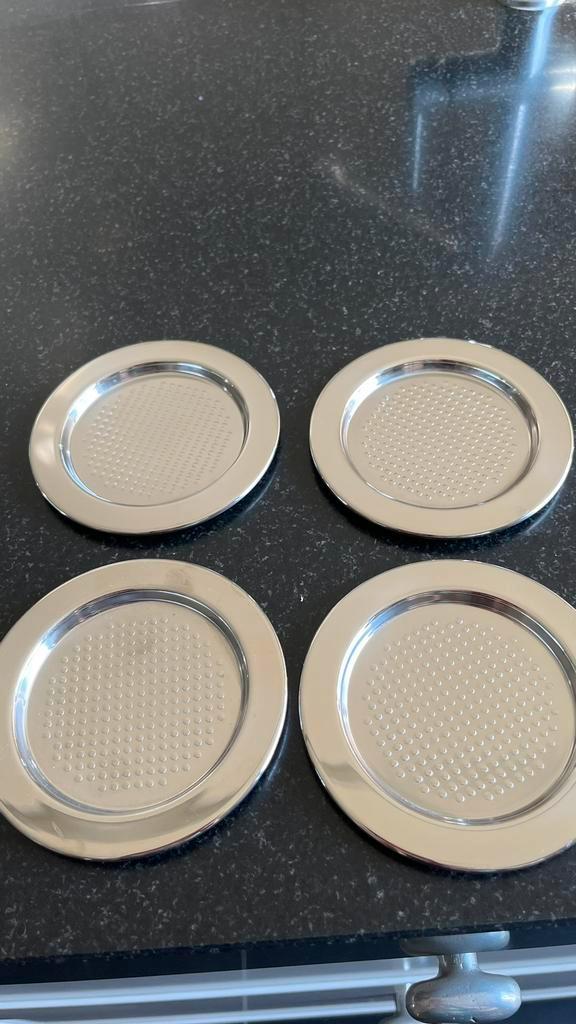 4 Alessi onderzetters - RVS design, Huis en Inrichting, Woonaccessoires | Onderzetters, Gebruikt, Glas of Kopje, Ophalen of Verzenden