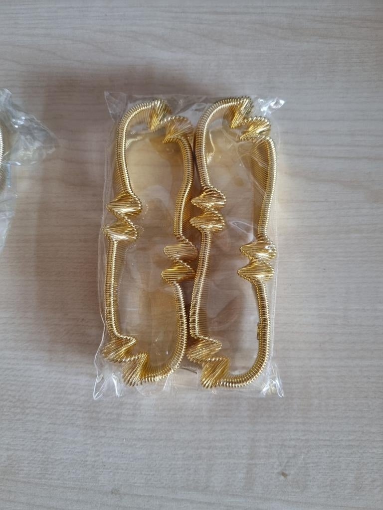 Nieuwe goudkleurige mouwophouders, Ophalen of Verzenden