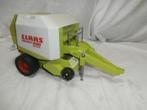 Bruder Claas ronde balen pers met baal en accessoires, Ophalen, Zo goed als nieuw