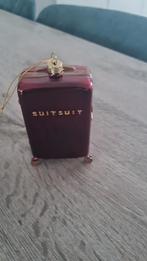 Suit merk kerstbal, Ophalen