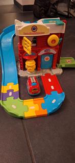 VTech Toet Toet Auto Brandweerkazerne, Kinderen en Baby's, Speelgoed | Babyspeelgoed, Ophalen of Verzenden, Zo goed als nieuw