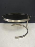 Salontafel van geborsteld staal en rookglas