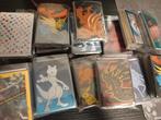 Pakjes met 50 Pokémon kaarten + 10 glimmende(holo) en meer!, Ophalen of Verzenden, Zo goed als nieuw, Losse kaart