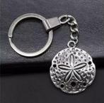 Sleutelhanger duiken zanddollar schelp DE ALLERLAATSTE!, https://www.kanoenduiksport.nl/contact/contact/, Overige typen, Nieuw