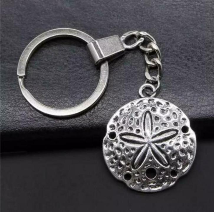 Sleutelhanger duiken zanddollar schelp DE ALLERLAATSTE!, Watersport en Boten, Duiken, Nieuw, Overige typen, Ophalen of Verzenden