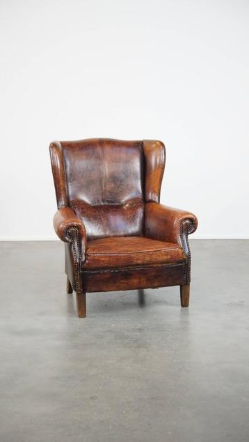 Cognac-kleurige, grote vintage schapenleren oorfauteuil beschikbaar voor biedingen