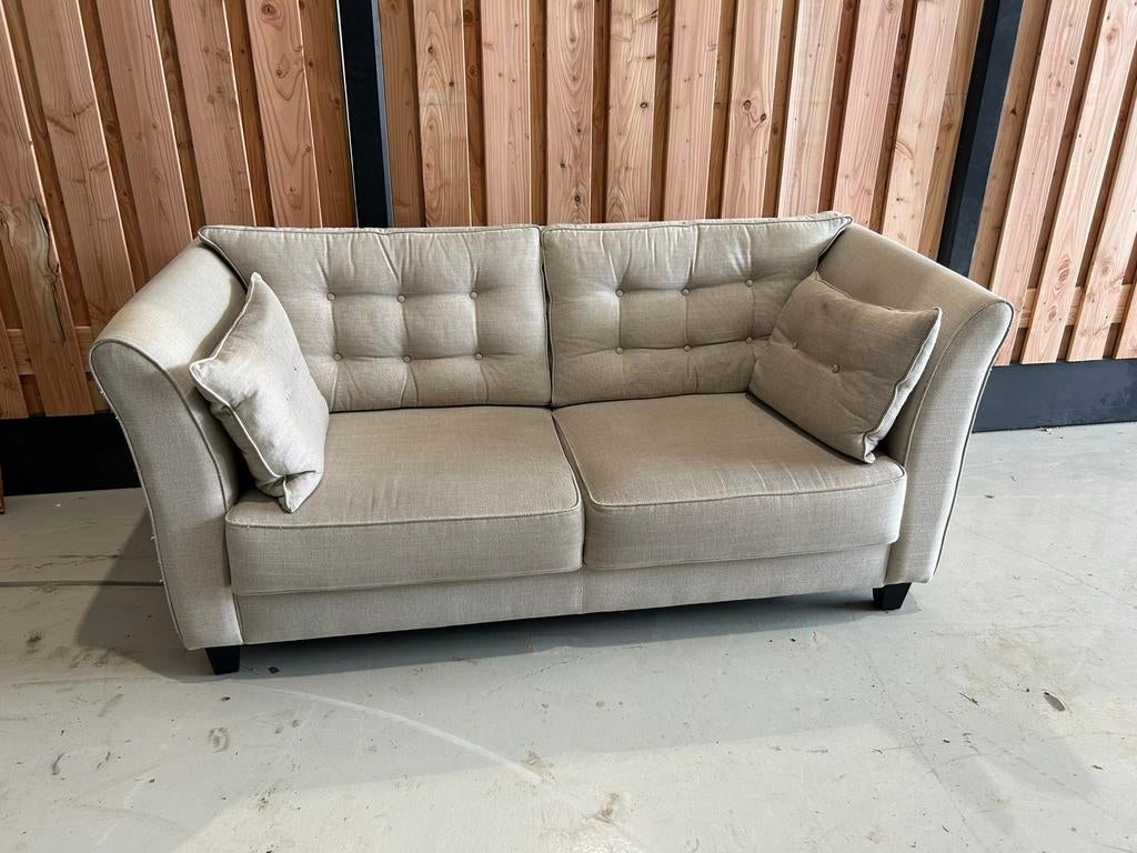 Crème 2-zitsbank van Woonhuis Elspeet, gereinigd