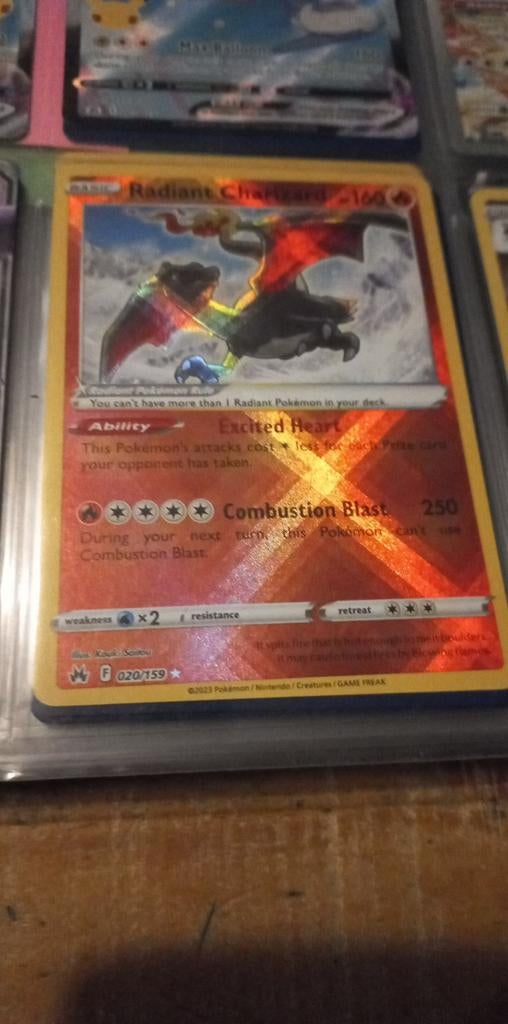 Radiand charizard, Ophalen of Verzenden, Zo goed als nieuw, Losse kaart, Foil