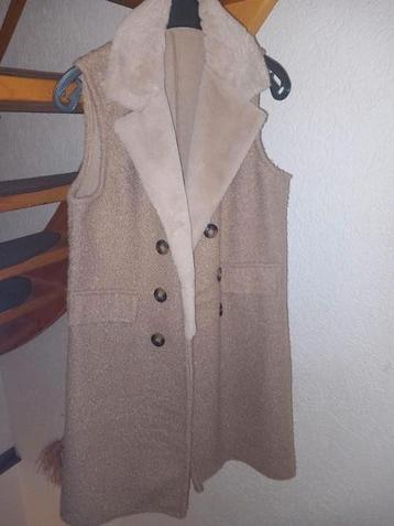 Lange bodywarmer maat M beige beschikbaar voor biedingen