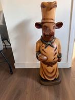Zwaar houten varken als kok, Ophalen