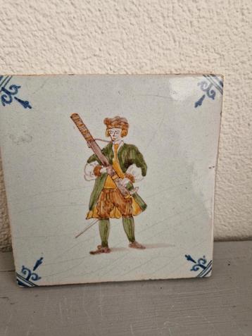 Oude Tegel met muzikant met fagot beschikbaar voor biedingen