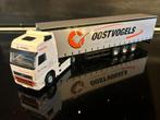 Volvo FH globetrotter Oostvogels met 3 as tautliner in doos, Hobby en Vrije tijd, Modelauto's | 1:50, Ophalen of Verzenden, Nieuw