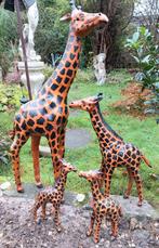 Vier Giraffen beelden van leder, Ophalen