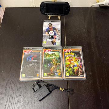 ️ Te Koop: Sony PSP-E1004 Handheld + 4 Games + Lader  beschikbaar voor biedingen
