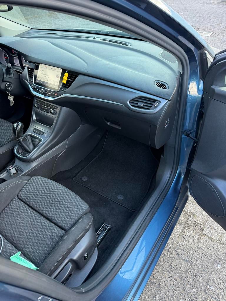 Opel Astra 1.0 Turbo 77KW 5D 2016 Blauw, Auto's, Stof, Zwart, Blauw, 610 kg