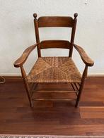 Antieke stoel met biezen zitting, Ophalen