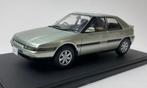 WhiteBox 1:24 Mazda 323 F light green met 2 openingen