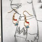 Goudkleurige oorbellen met Hello Kitty hangertjes, Overige materialen, Verzenden, Nieuw, Knopjes of Stekers