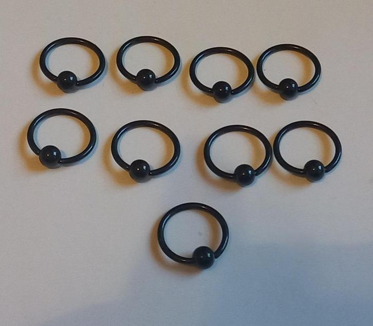 Zwarte piercing ringetjes 1,2 x 10 mm., Sieraden, Tassen en Uiterlijk, Piercings, Nieuw, Overige typen, Staal, Ophalen of Verzenden