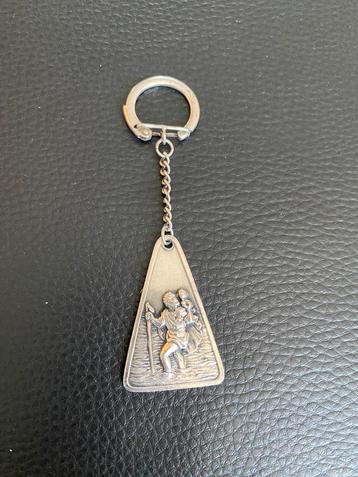 Sleutelhanger verzilverd. beschikbaar voor biedingen