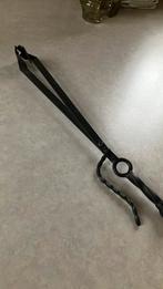 Gietijzeren haardtang, Ophalen