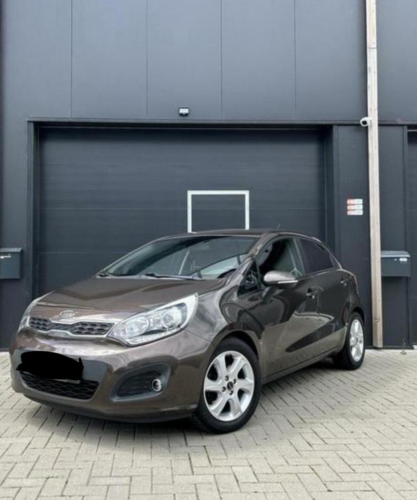 Kia Rio 1.4 Cvvt 80KW H6 5DRS 2011 Bruin, Auto's, Kia, Voorwielaandrijving, 450 kg, 49 €/maand, Origineel Nederlands