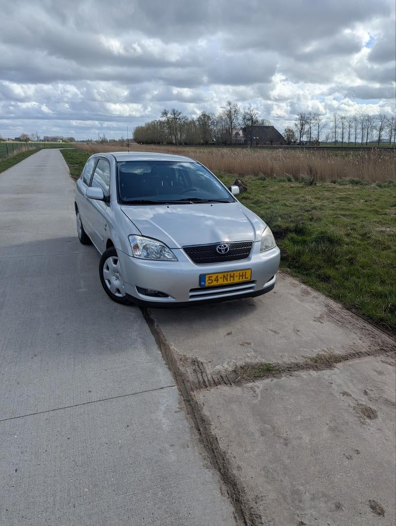 Toyota Corolla 1.4 Vvt-i 3DR Linea SOL 2003 Grijs, Auto's, Voorwielaandrijving, 1398 cc, 4 cilinders, Corolla
