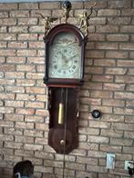 Antieke Friese staart klok, Ophalen