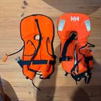 Twee Helly Hansen zwemvesten kinderen 20-35kg, Ophalen of Verzenden, Zo goed als nieuw, Kind, Reddingsvest of Zwemvest