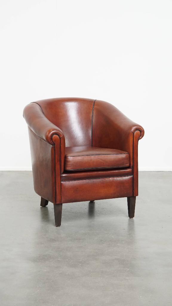 Mooie schapenleren clubfauteuil afgewerkt met zwarte biezen, Huis en Inrichting, Fauteuils, Gebruikt, Leer, 75 tot 100 cm, 75 tot 100 cm