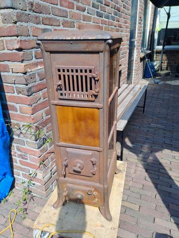 Gietijzeren hout/kolenkachel tegelkachel beschikbaar voor biedingen