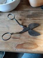 Antieke kaarsensnuiter, Ophalen