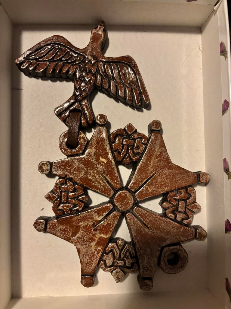 Hugenotenkruis, grahis afhalen, Ophalen