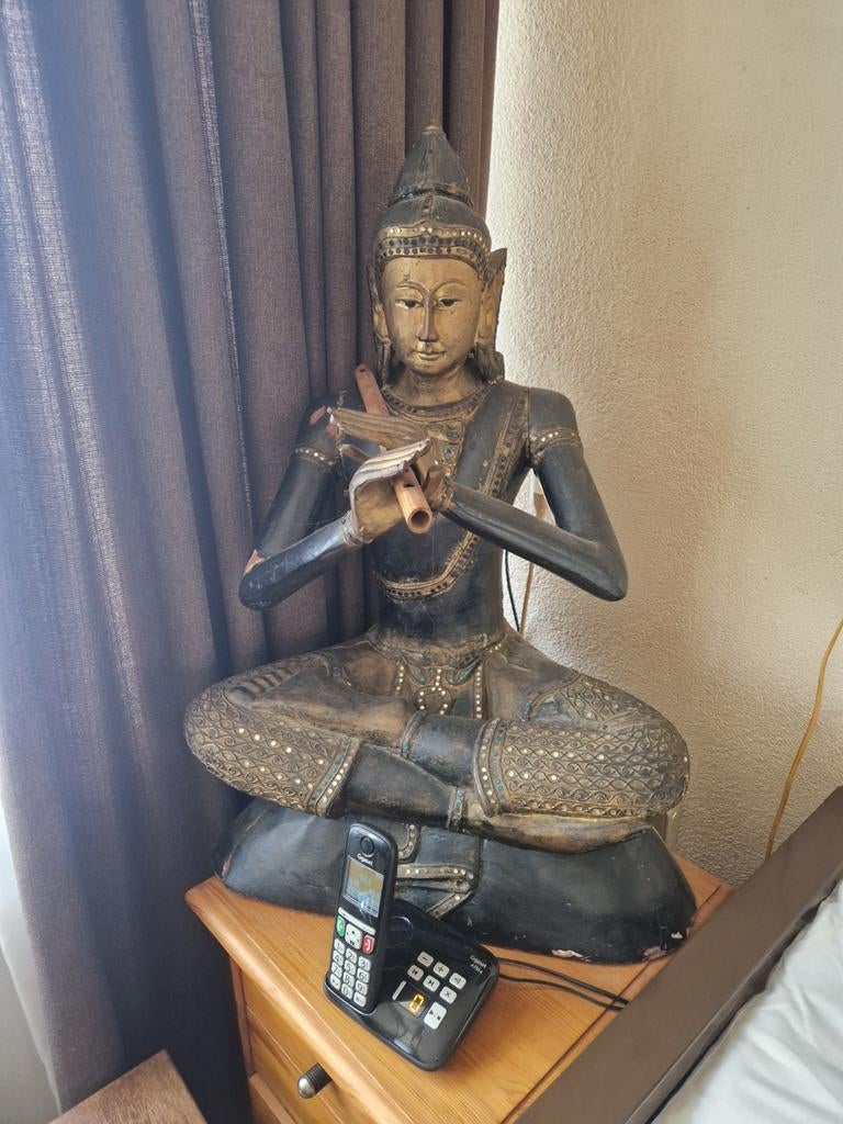 Houten Boeddhabeeld met fluit, Ophalen