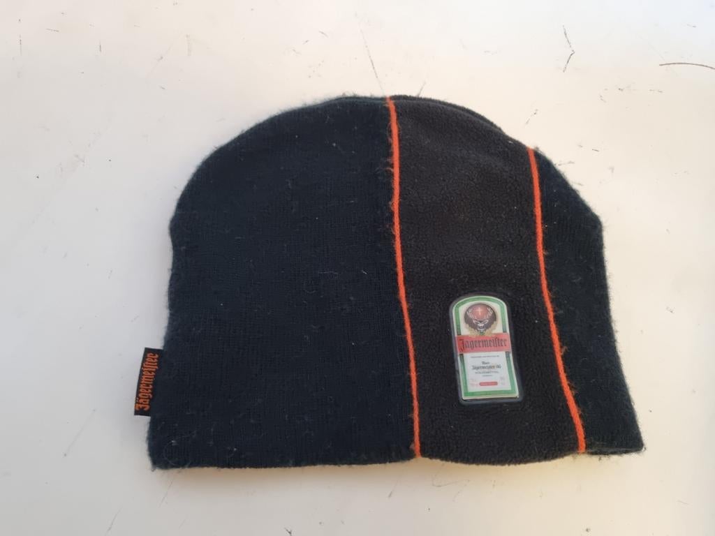 Jägermeister Muts Zwart met Oranje Accent one size fits all, Zwart, Ophalen of Verzenden, Zo goed als nieuw, Met patroon