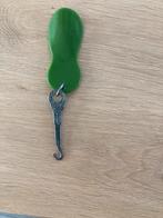 Antiek knopenhaakje met schoenlepel, Ophalen