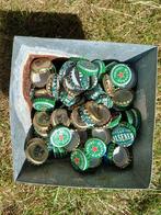 Bak vol bierdoppen, vooral Heineken, Amstel en Brand, Ophalen